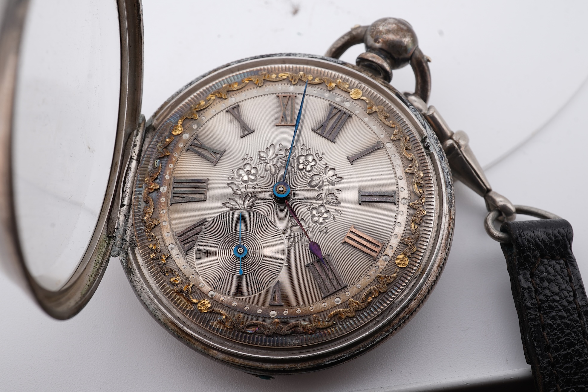 An early 20th century continental 800 standard white metal open faced chronograph pocket watch, with Roman numerals and two subsidiary dials, case diameter 50mm, together with a similar smaller white metal open faced poc